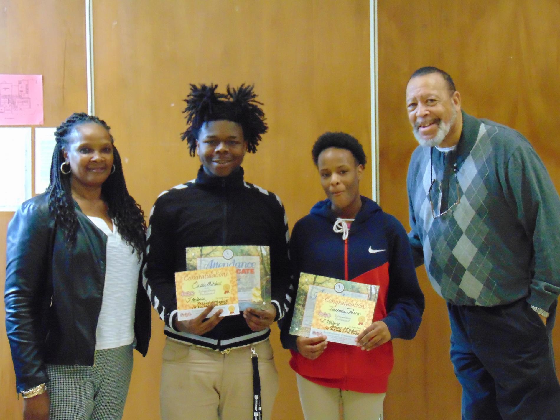 Cedric Mitchell and Darrencia Johnson receive improved attendance awards Cedric Mitchell and Darrencia Johnson receive improved attendance awards
