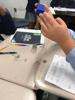 Students designed an electromagnet to hold at least 50 paperclips.