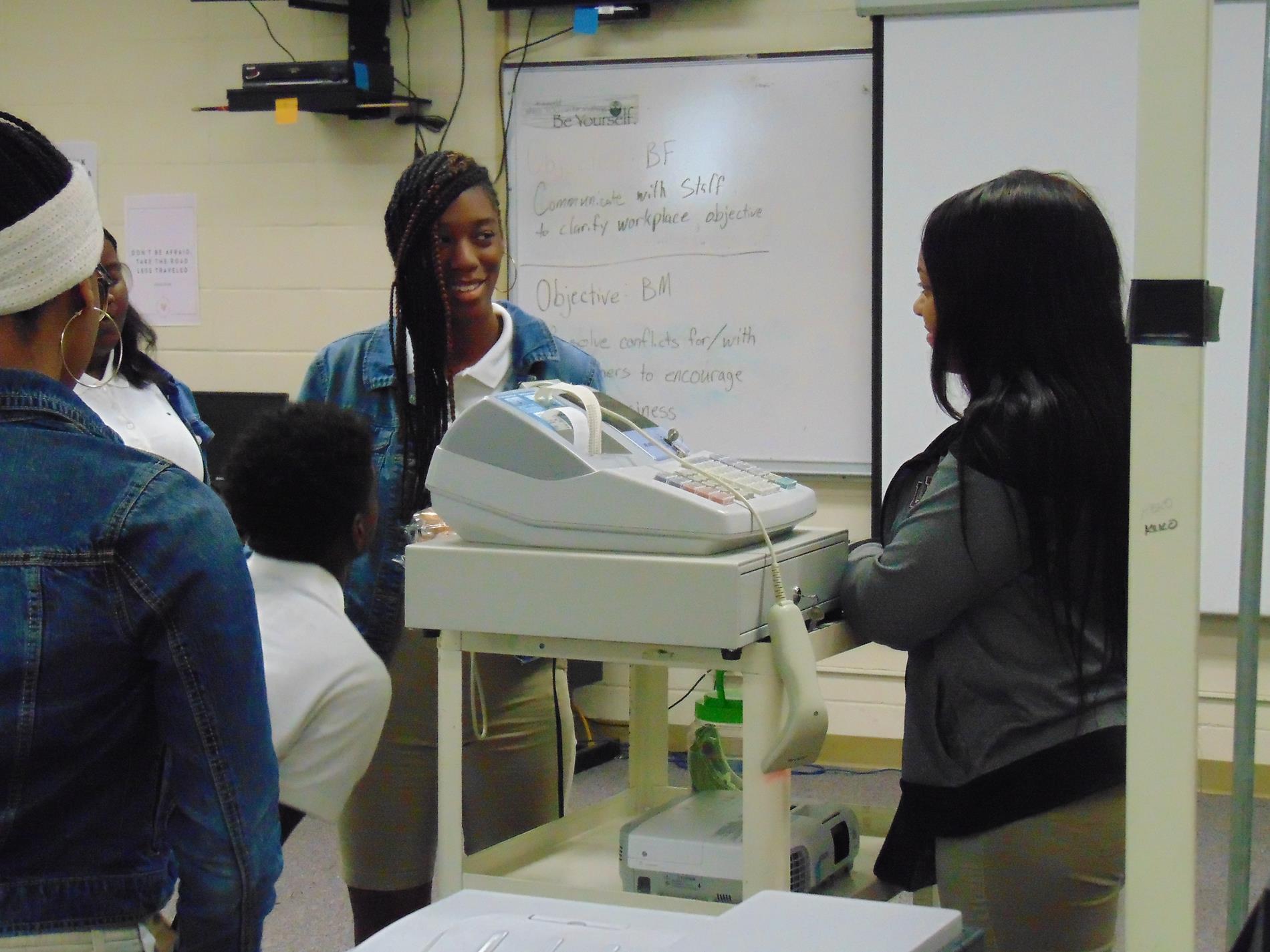 Business Fundamentals class practicing retail skills