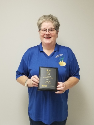 Denise Parson Holding No Kid Hungry Plaque