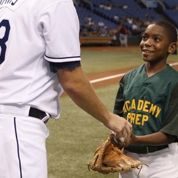 student with baseball player