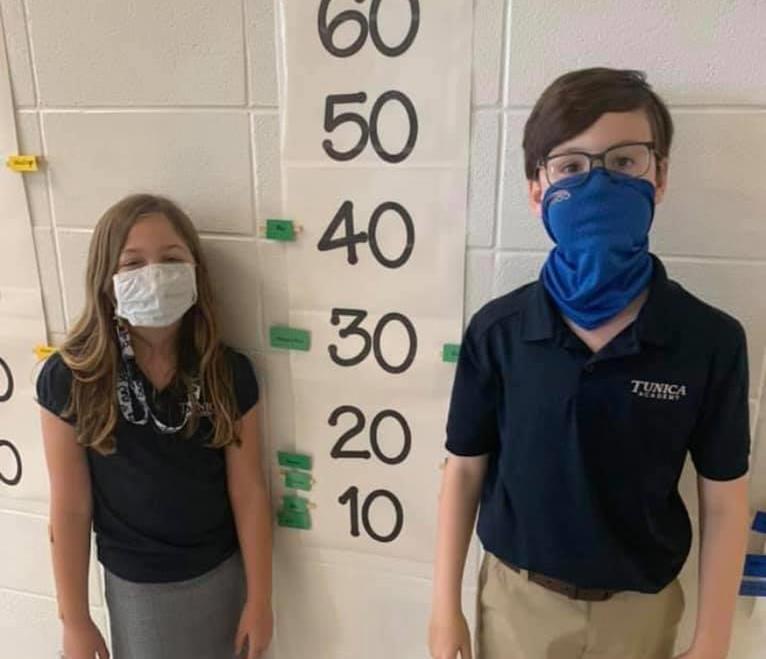 children standing next to their accumulated AR points