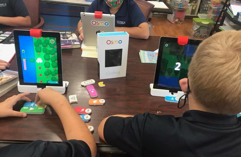 students learning basic coding skills