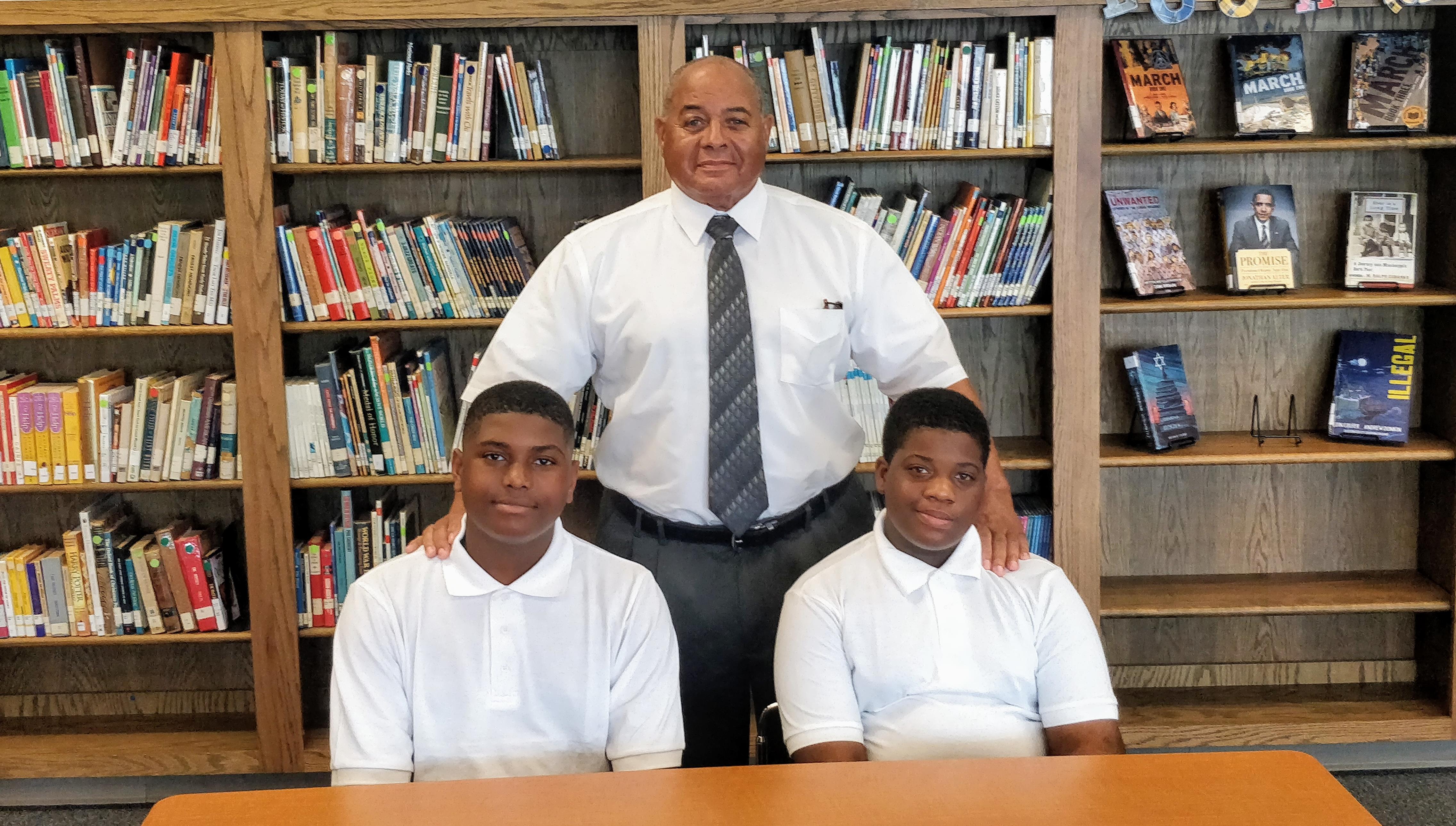 Pictured: (Left) Tamarcus Harkins, (Right) Joshua Taylor, Principal Fred Young